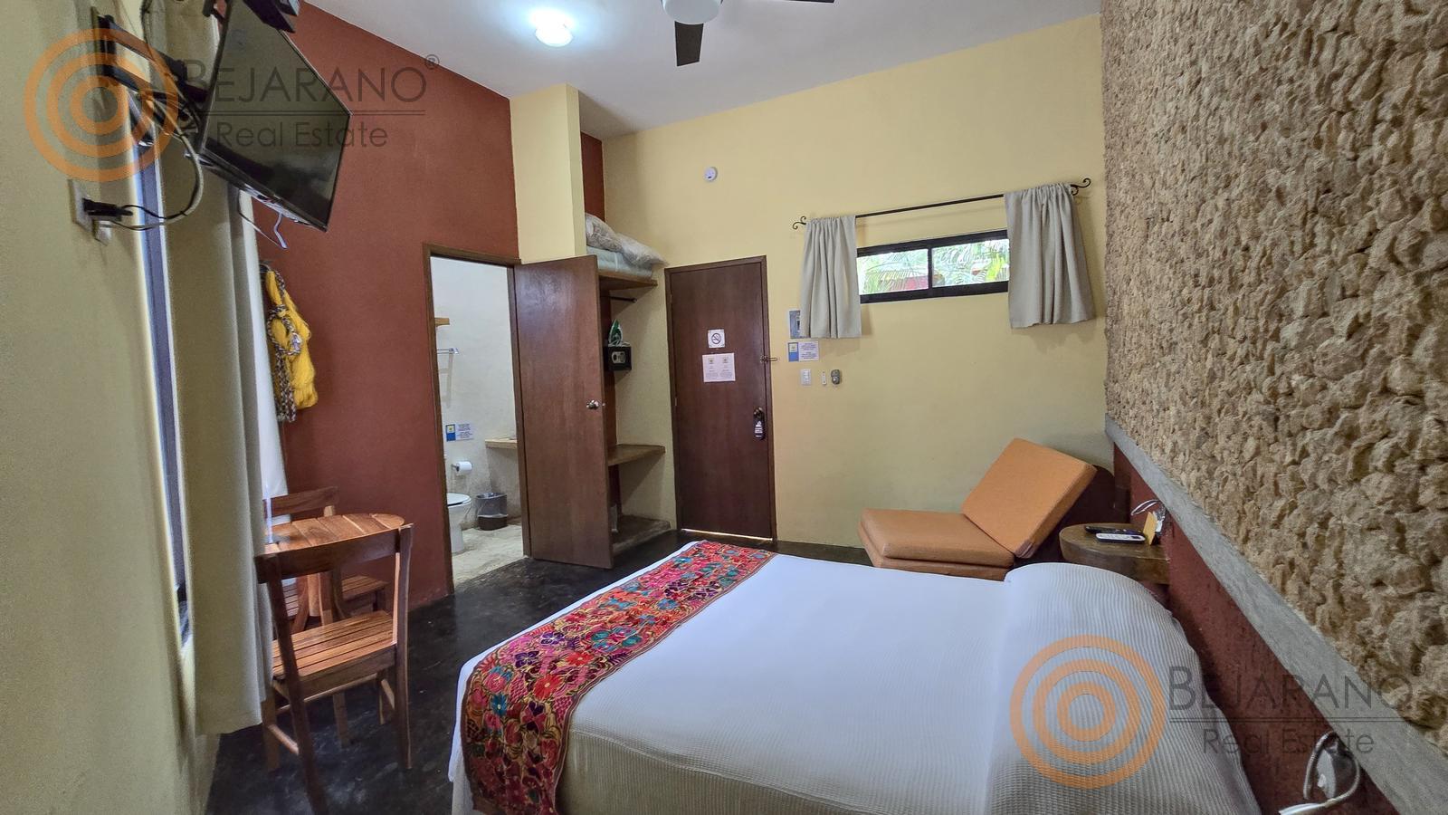 bre-hv-56sisal-12 Habitación con muro de piedra y textil artesanal en el hotel